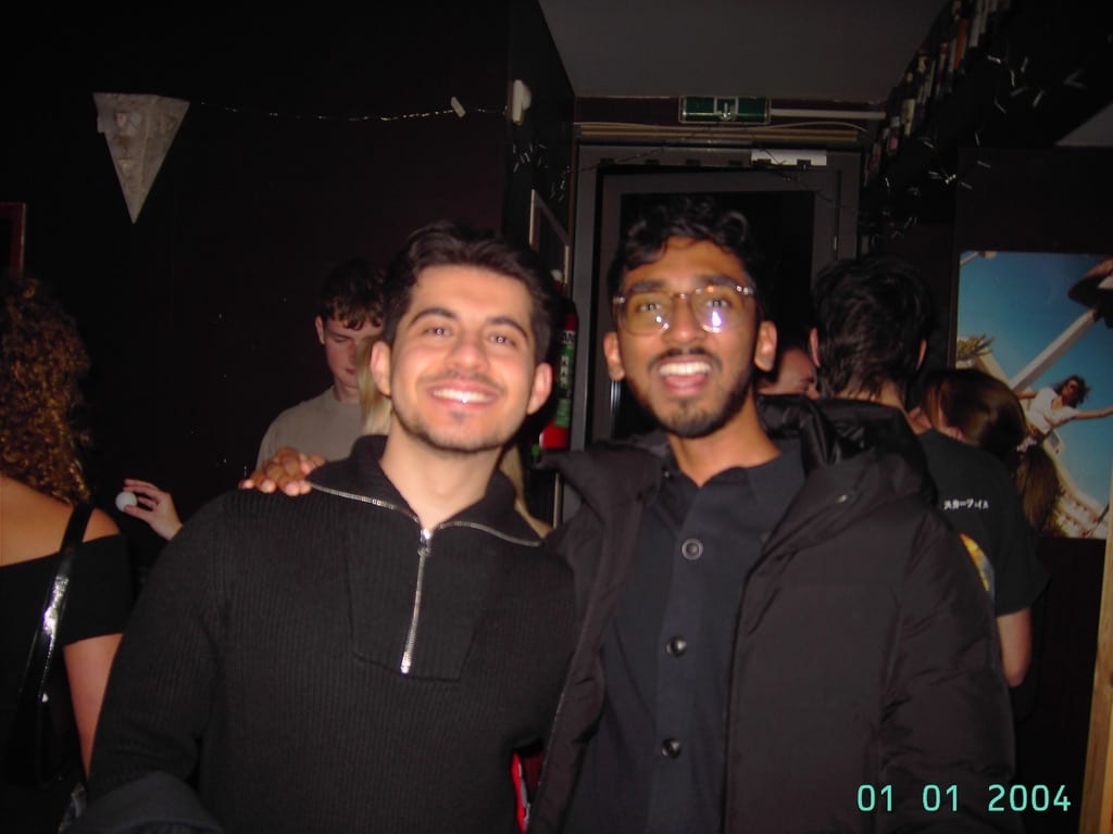 Mir and Bhuvan laughing together at a party in Eindhoven